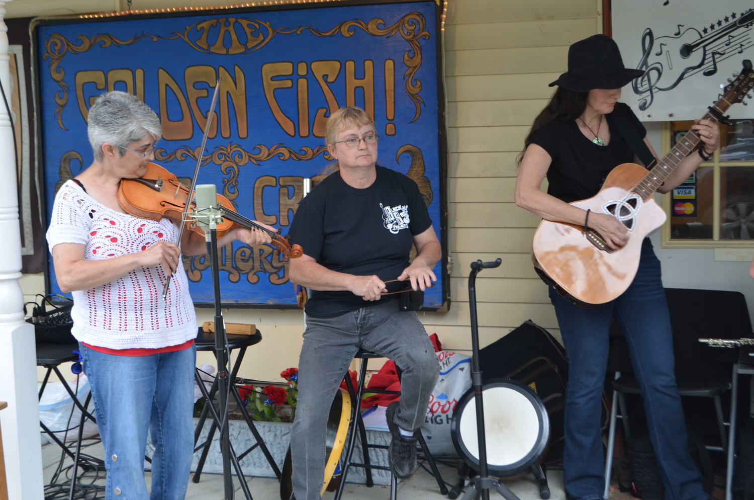 The Black Sage Project earned a crowd around them as they played well known folk and country songs.